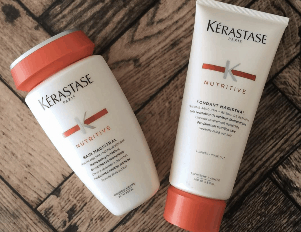 Kerastase's Nutritive Shampoo and Conditioner wood backdrop