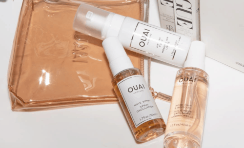 ouai wave spray and product backdrop