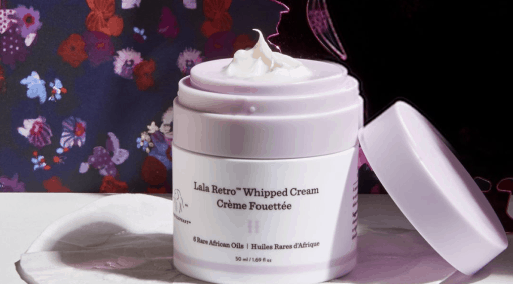 Drunk Elephant Lala Retro Whipped Cream Product Florals Background