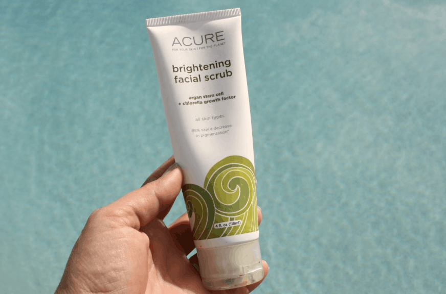 Acure's Brightening Facial Scrub Water Backdrop