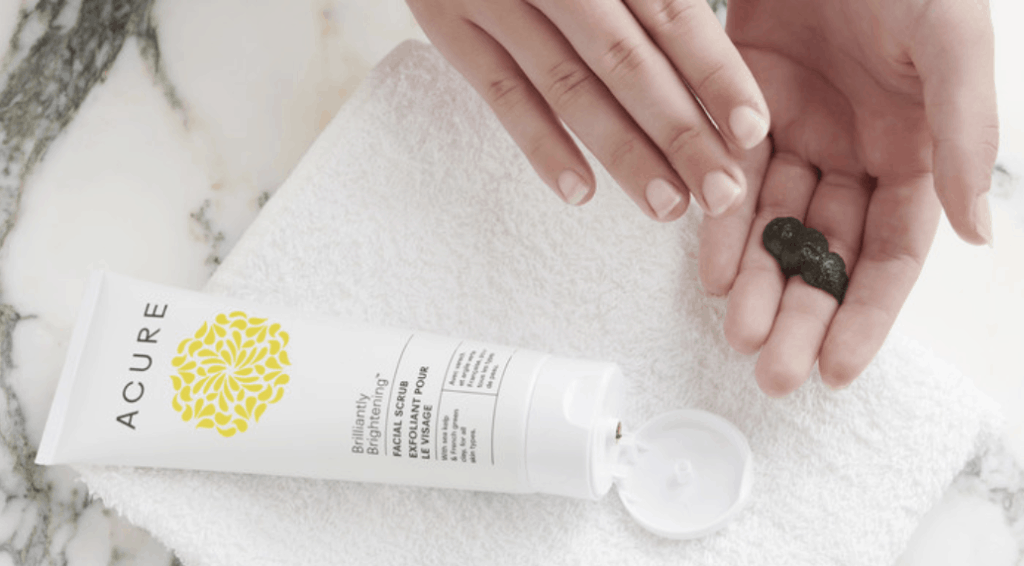 Acure's Brightening Facial Scrub hands