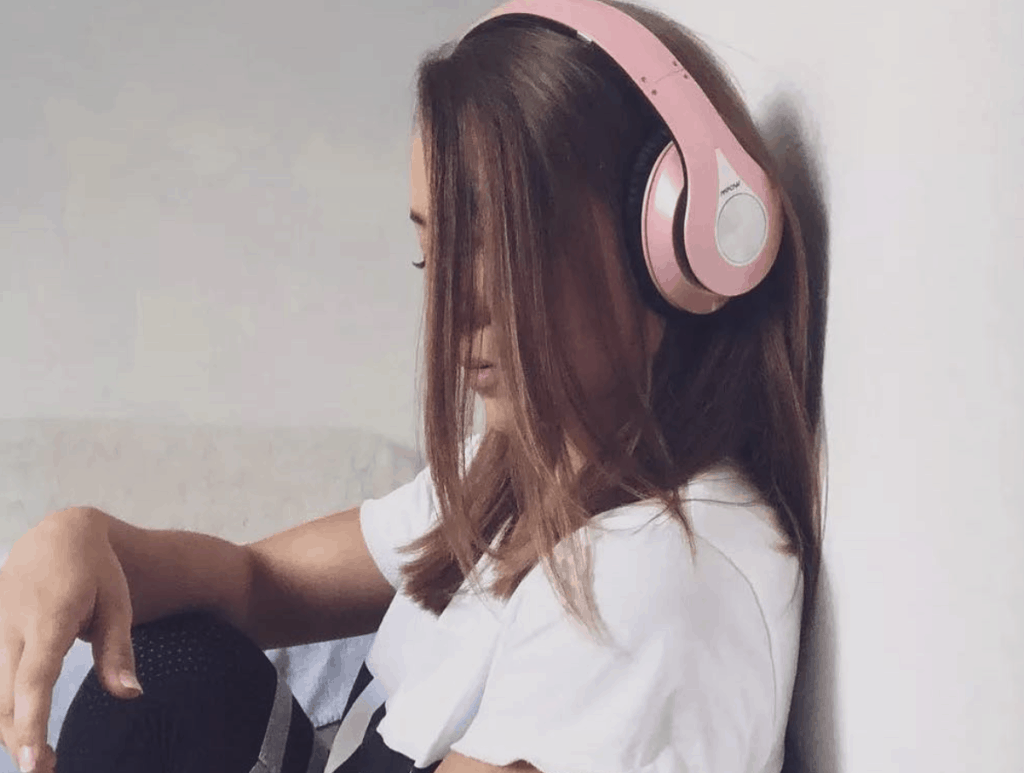 Mpow's 059 Bluetooth Headphones female model