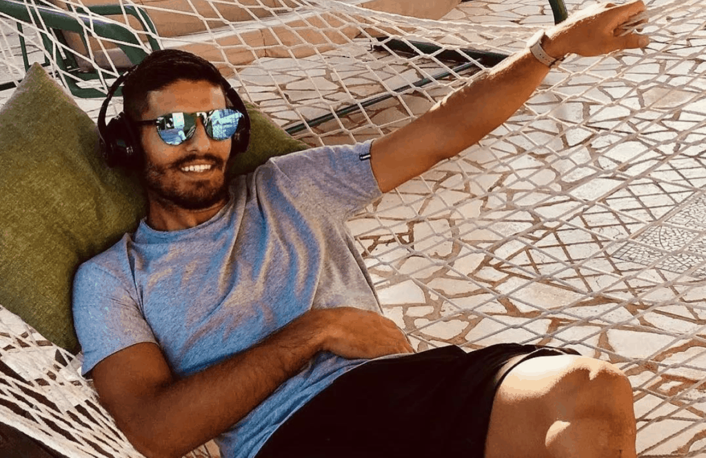 Mpow's 059 Bluetooth Headphones Male on beach music