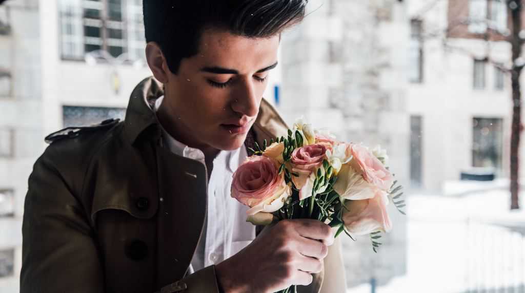image of man holding red roses valentine theme