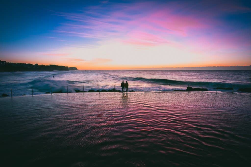 far shot image of couple on beach romantic setting 